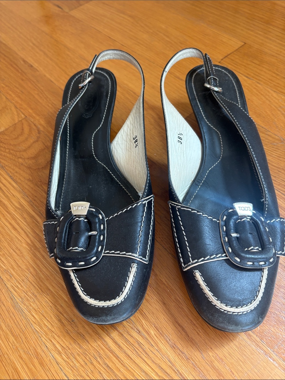 Tod's Black Leather Slingback Mules with Cream Stitching